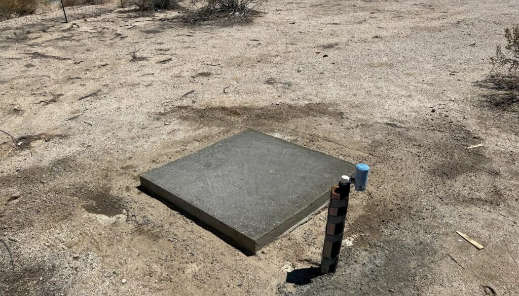 Dry Pouring a Concrete Slab for a New Shed in the Desert During the Height of Summer